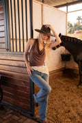 Model wearing the Sevilla Jean, high-rise straight-leg jeans in a medium blue wash