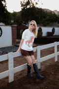 Model wearing the Andalucia ivory knit blouse with an embellished sequin horse design