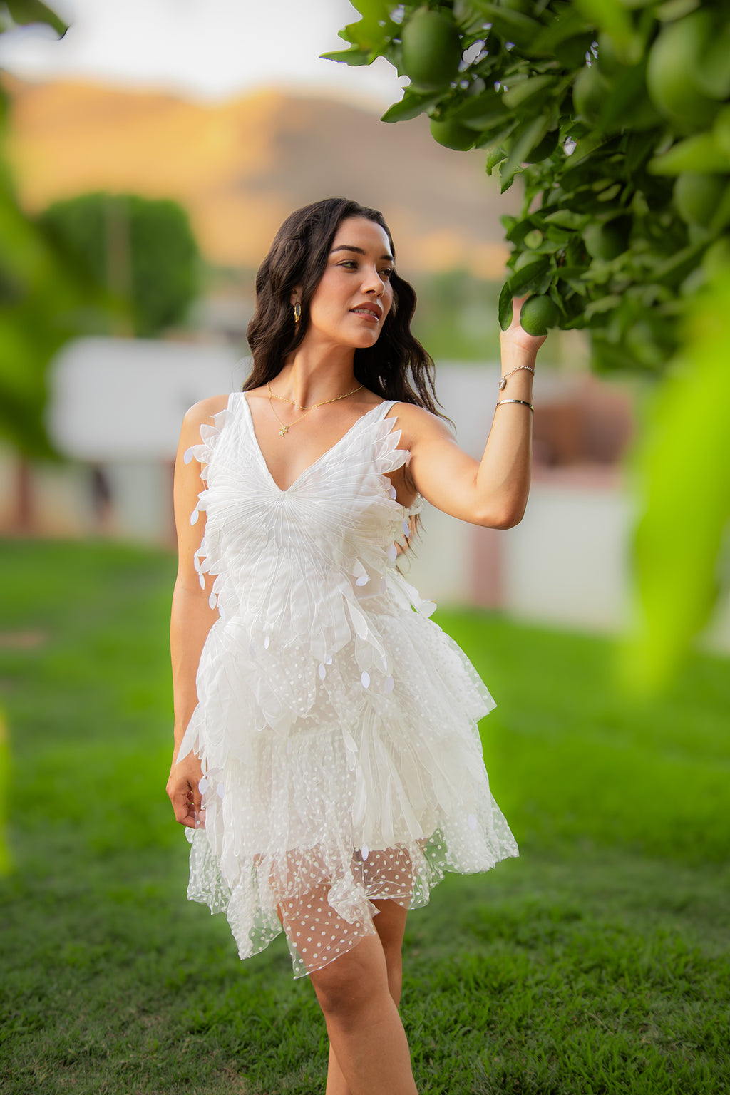 Carolina Dress white tulle mini dress styled outdoors in a garden