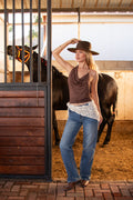Genevieve Brown Top chocolate cowl neck halter styled with straight-leg jeans and a wide-brim hat